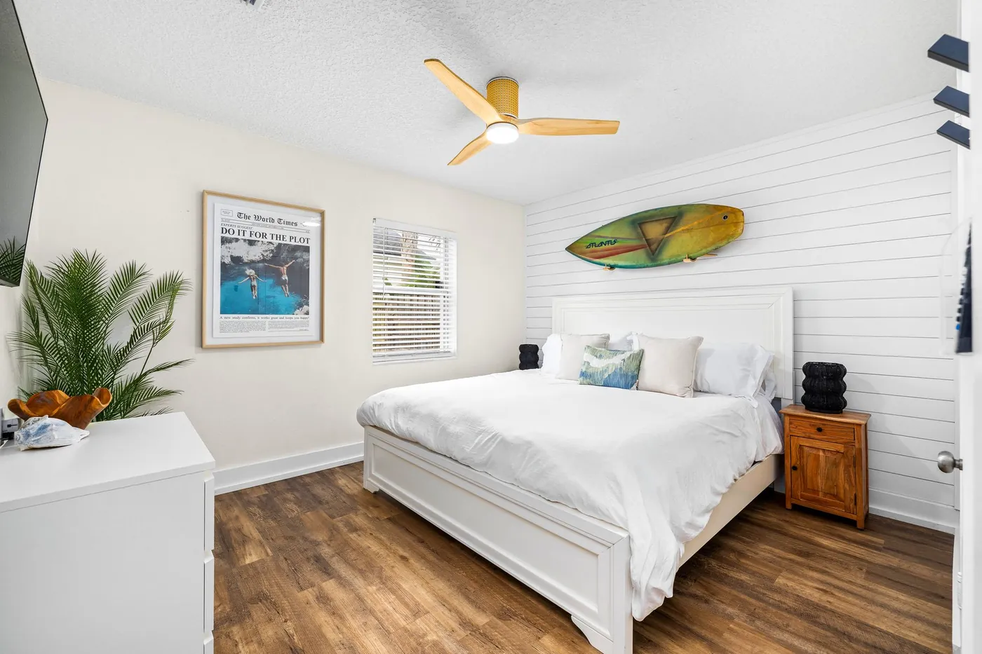 Family Tides bedroom with surfboard wall art