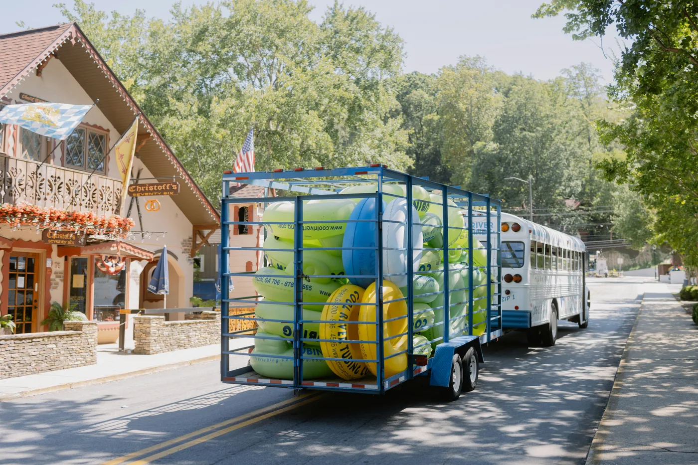 Cool River Tubing shuttle bus loaded with tubes on Main Street in Helen, Georgia