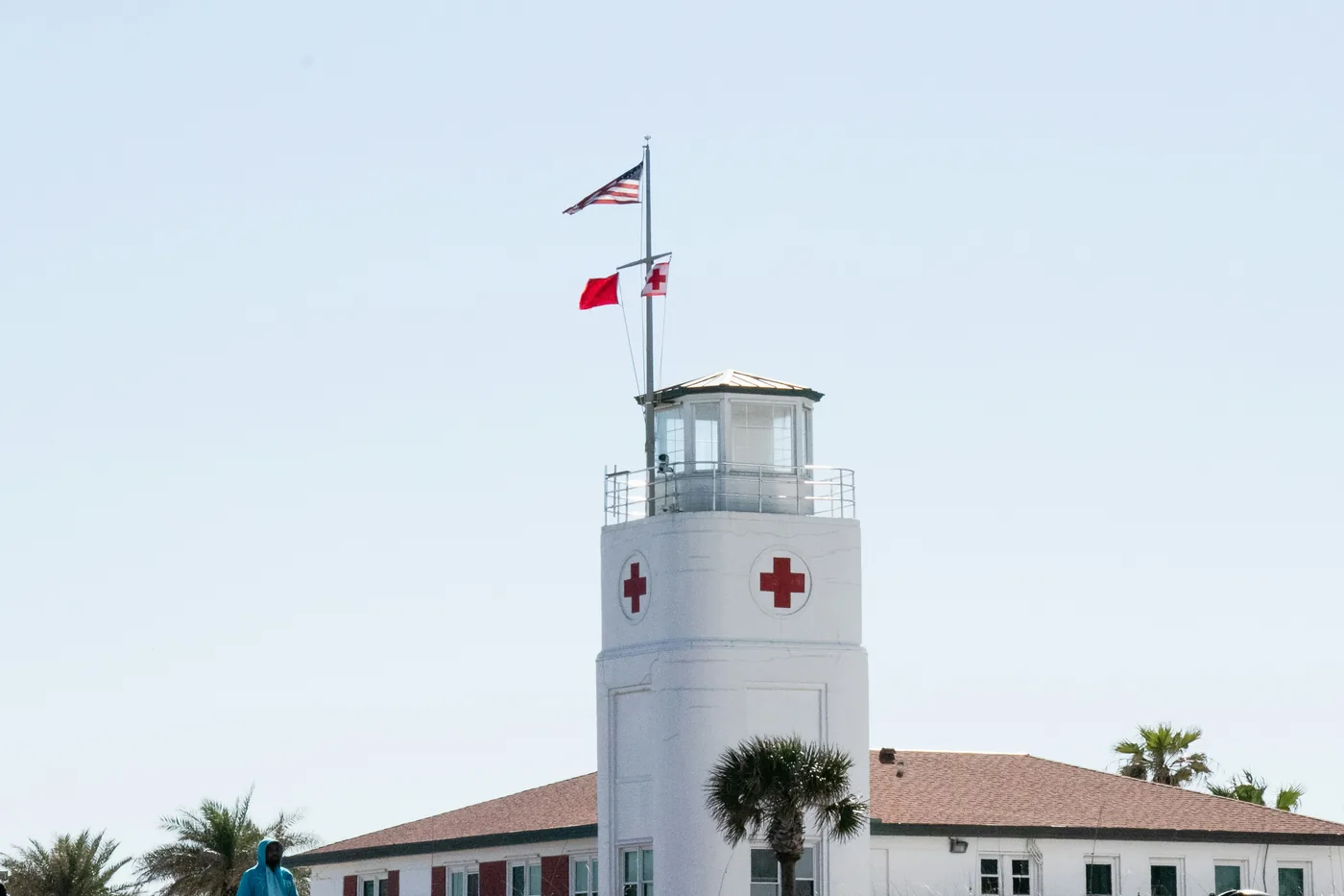 Historic lifeguard station tower with flags at Jacksonville Beach, Florida