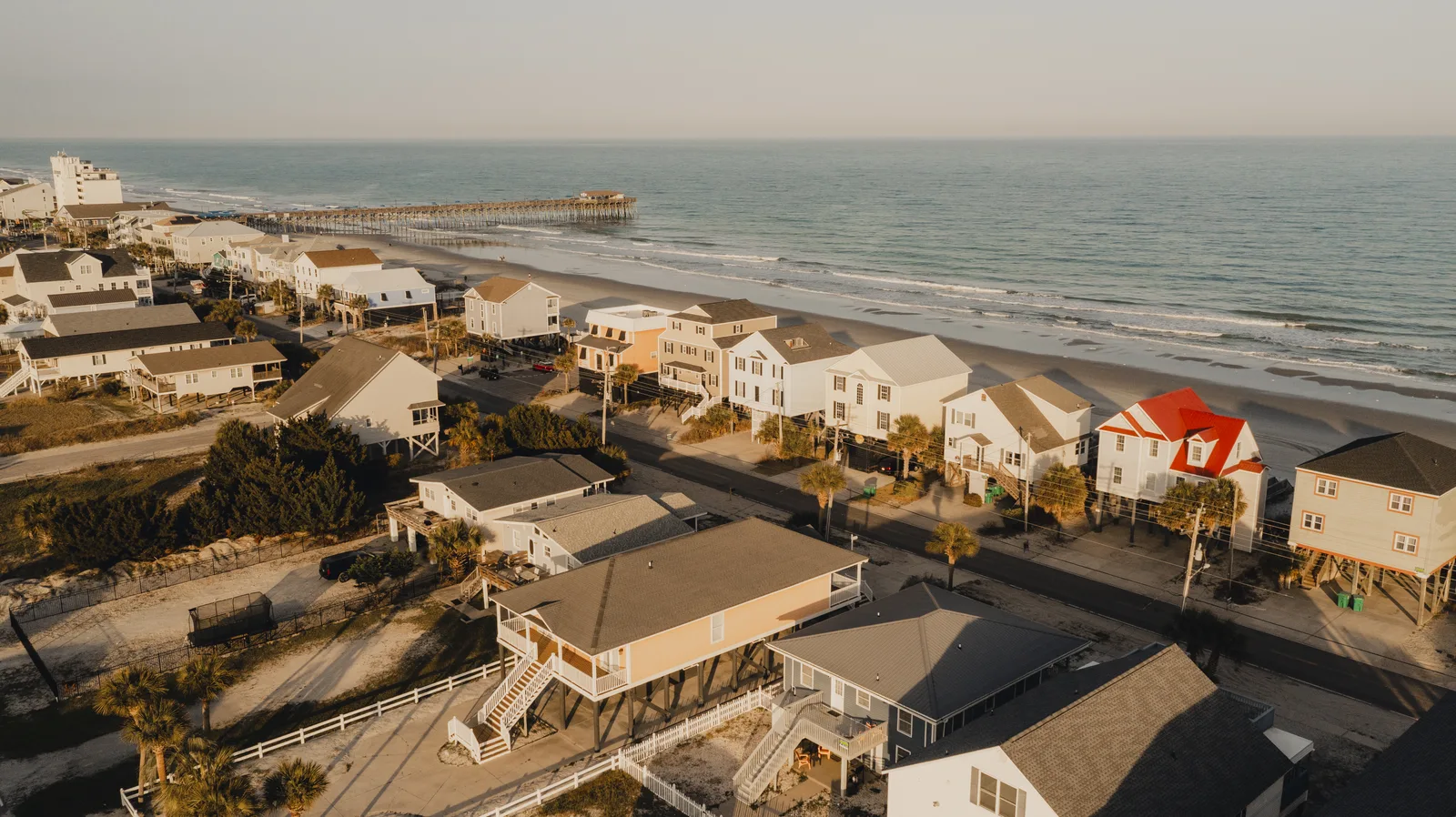 Aerial view of Garden City Beach homes, the pier, and the Atlantic near Kailani House