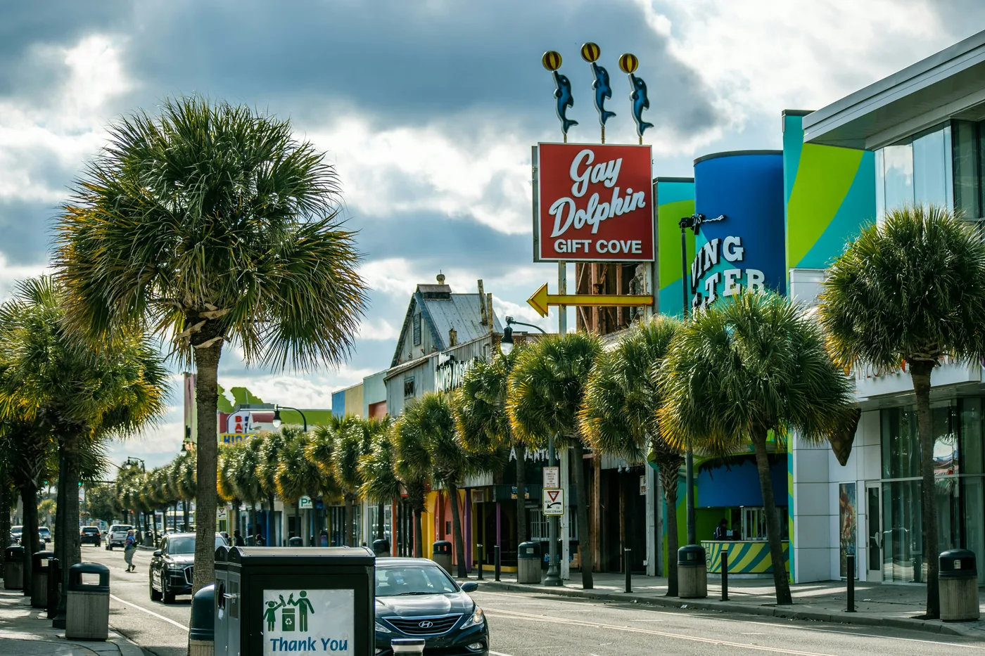 Palm-lined street with colorful storefronts in Myrtle Beach, South Carolina
